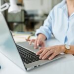 Closeup image of PR manager answering sending a pitch via emails to media